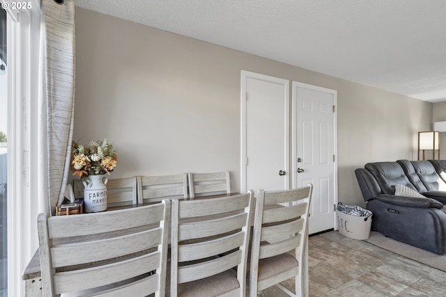 dining area with a textured ceiling