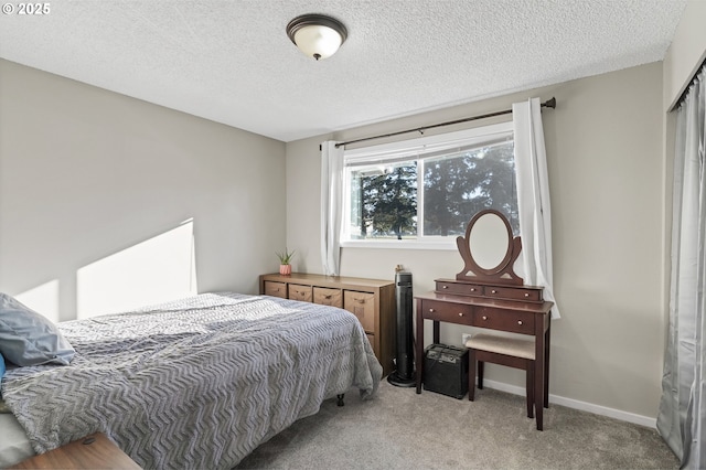 carpeted bedroom with a textured ceiling