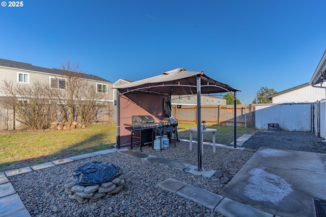 view of yard with an outdoor fire pit