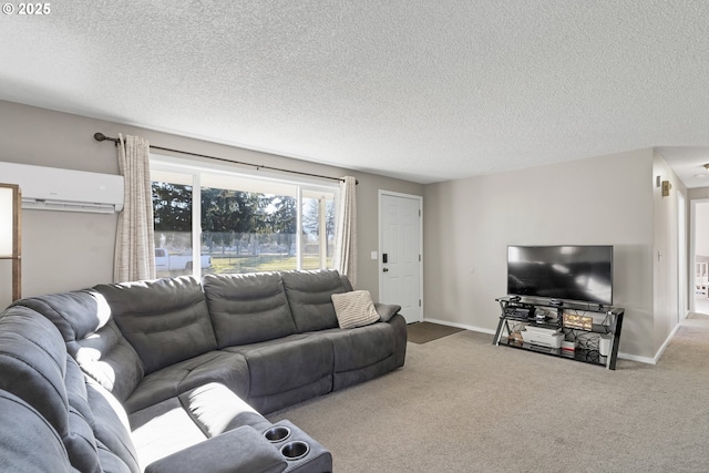 living room featuring carpet floors, a wall unit AC, and a textured ceiling