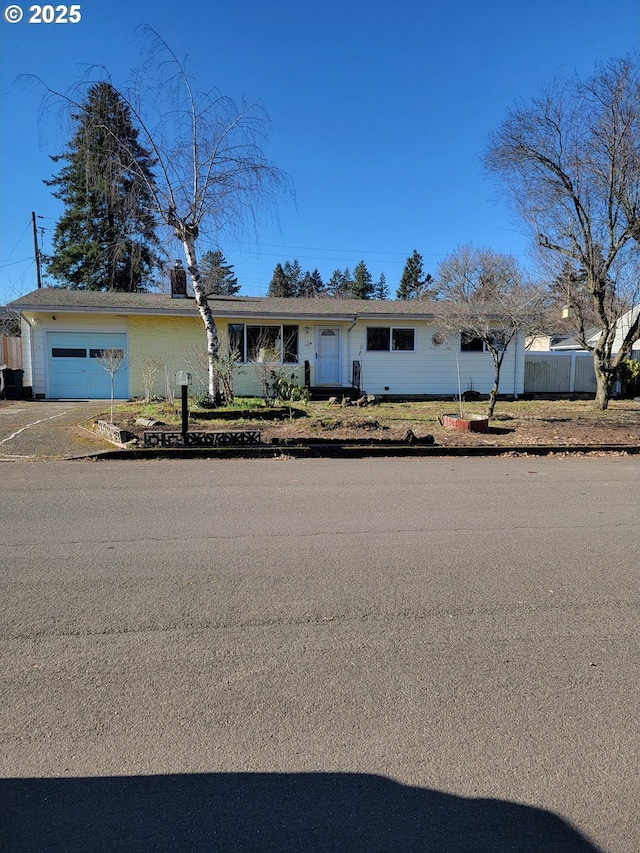 ranch-style house featuring a garage