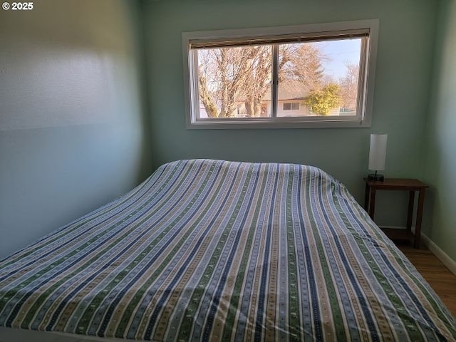 bedroom featuring wood-type flooring