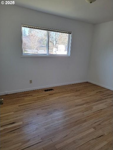 empty room featuring hardwood / wood-style floors