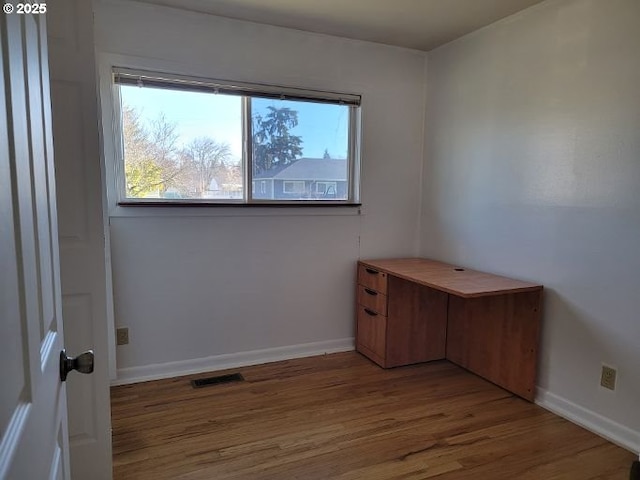 unfurnished room featuring hardwood / wood-style floors