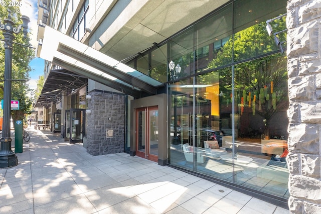 entrance to property featuring stone siding