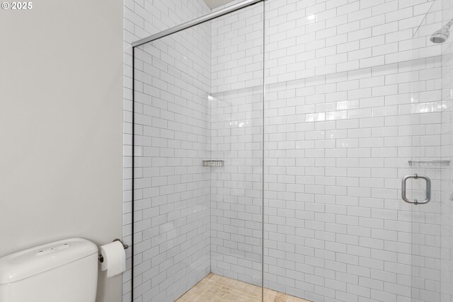1025 NW Couch St Unit 1415, Portland, OR 97209 - full bathroom with a shower stall and toilet