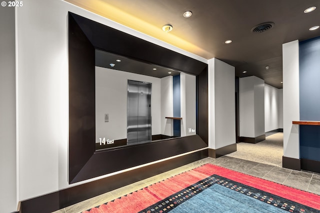 building lobby featuring visible vents