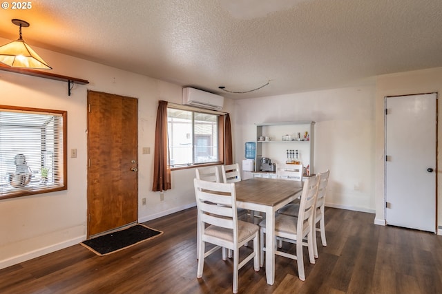 dining space with dark hardwood / wood-style flooring, a wall mounted air conditioner, and a textured ceiling