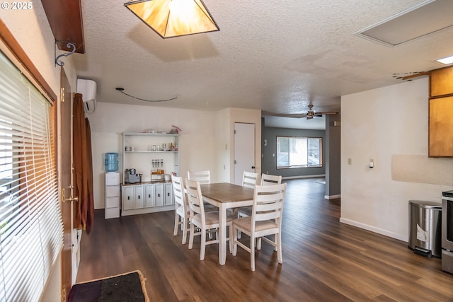 dining space featuring ceiling fan, a textured ceiling, dark wood-type flooring, and a wall mounted AC