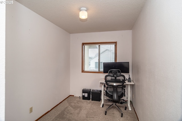 office area with carpet and a textured ceiling