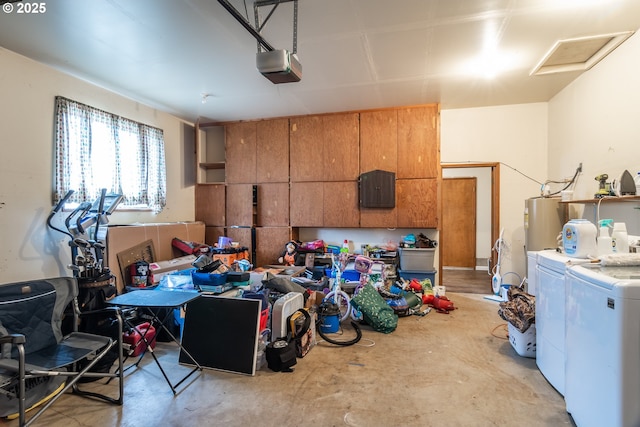 garage featuring independent washer and dryer, a garage door opener, and water heater