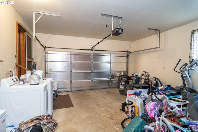 garage featuring a garage door opener and washer and dryer