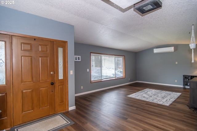 entryway with an AC wall unit, dark hardwood / wood-style floors, lofted ceiling, wine cooler, and a textured ceiling