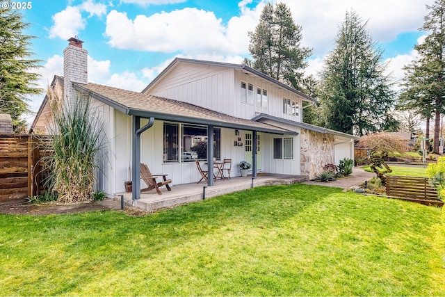 3730 NW 183rd Ave, Portland, OR 97229 - rear view of house featuring a chimney, covered porch, roof with shingles, an attached garage, and board and batten siding