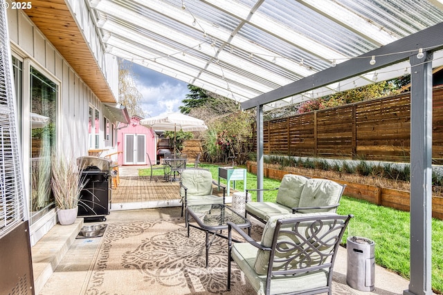 3730 NW 183rd Ave, Portland, OR 97229 - fenced backyard with an outdoor living space, a storage shed, a wooden deck, and area for grilling