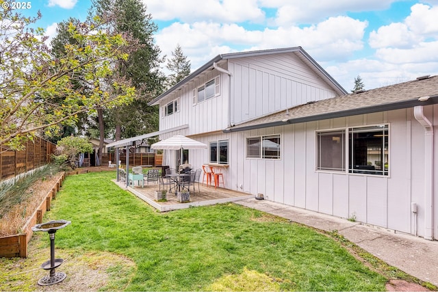 3730 NW 183rd Ave, Portland, OR 97229 - back of house with a shingled roof, a fenced backyard, a patio, and board and batten siding