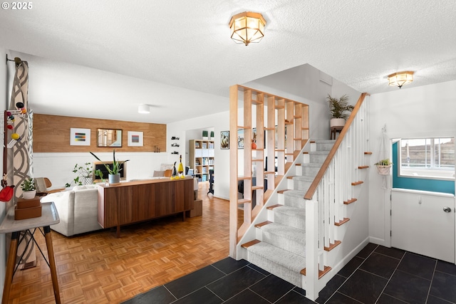 3730 NW 183rd Ave, Portland, OR 97229 - staircase featuring a textured ceiling