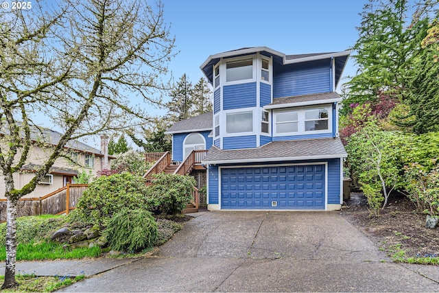 4939 Hampton Ct, Lake Oswego, OR 97035 - view of front of house with driveway, stairs, an attached garage, and roof with shingles