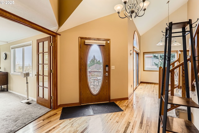 4939 Hampton Ct, Lake Oswego, OR 97035 - entrance foyer with a chandelier, light wood-type flooring, lofted ceiling, and baseboards