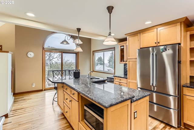 4939 Hampton Ct, Lake Oswego, OR 97035 - kitchen featuring stainless steel appliances, light brown cabinets, glass insert cabinets, light wood finished floors, and recessed lighting