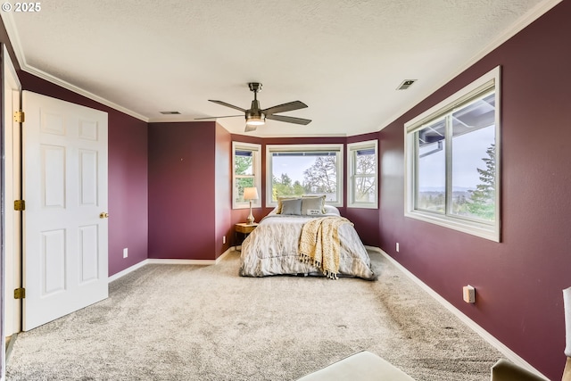 4939 Hampton Ct, Lake Oswego, OR 97035 - carpeted bedroom featuring multiple windows, baseboards, ornamental molding, a ceiling fan, and a textured ceiling