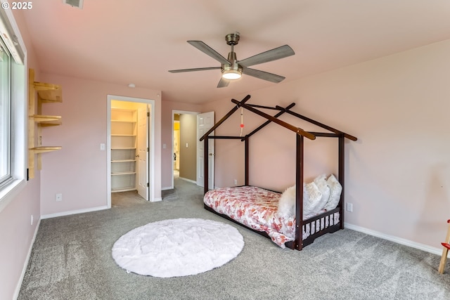 4939 Hampton Ct, Lake Oswego, OR 97035 - carpeted bedroom with baseboards, a closet, a walk in closet, and a ceiling fan