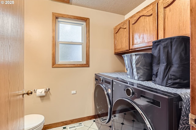 4939 Hampton Ct, Lake Oswego, OR 97035 - laundry area featuring washing machine and clothes dryer, baseboards, and a textured ceiling
