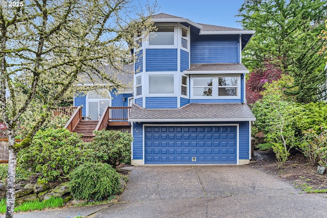 4939 Hampton Ct, Lake Oswego, OR 97035 - view of front facade with a shingled roof, a garage, driveway, and stairway