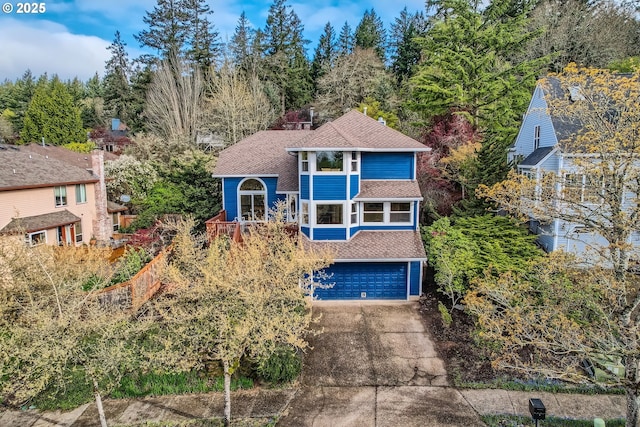 4939 Hampton Ct, Lake Oswego, OR 97035 - view of front of home featuring roof with shingles, concrete driveway, and a garage