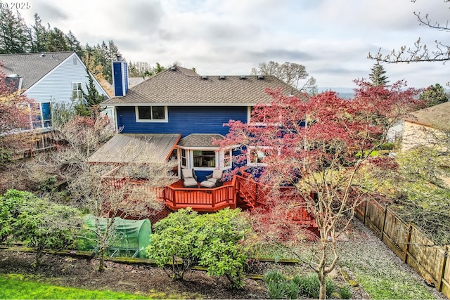 4939 Hampton Ct, Lake Oswego, OR 97035 - back of property with a chimney, a fenced backyard, a wooden deck, and roof with shingles