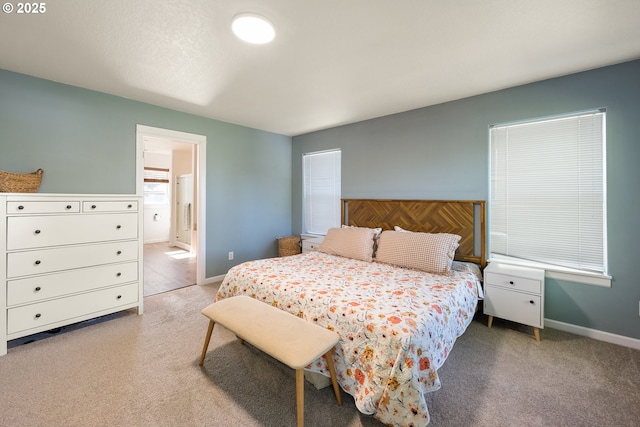 18246 SW Orlov Ct, Beaverton, OR 97078 - bedroom with light colored carpet, baseboards, and ensuite bathroom
