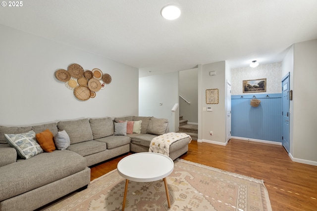 18246 SW Orlov Ct, Beaverton, OR 97078 - living area featuring wood finished floors, stairway, and baseboards