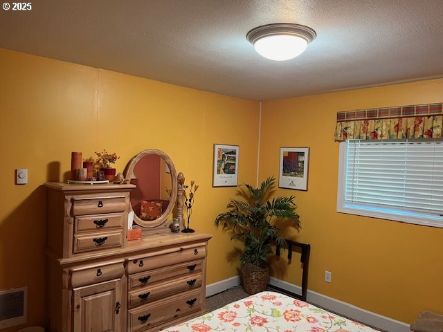 bedroom featuring a textured ceiling