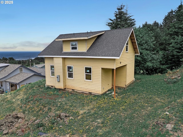 227 Windsong St, Yachats, OR 97498 - view of property exterior featuring a shingled roof and a yard