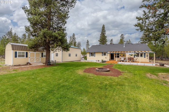 145343 Birchwood Dr, La Pine, OR 97739 - back of property featuring a fire pit, a yard, and a wooden deck