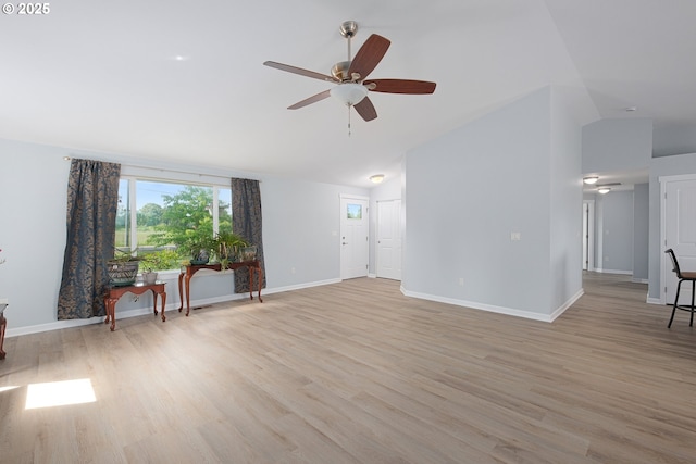 5615 Macleay Rd, Salem, OR 97317 - unfurnished living room with vaulted ceiling, ceiling fan, light wood finished floors, and baseboards