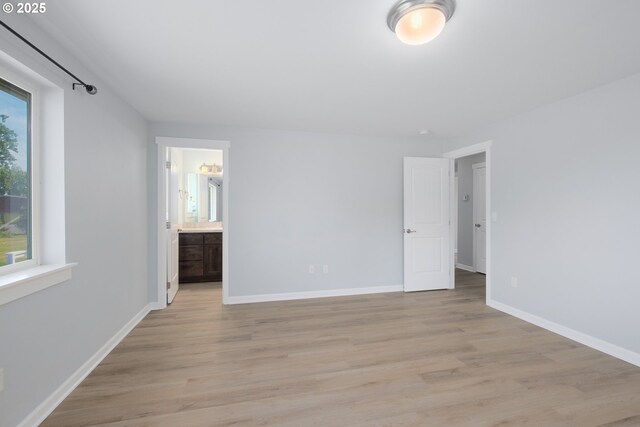 5615 Macleay Rd, Salem, OR 97317 - unfurnished bedroom with light wood finished floors, baseboards, and ensuite bath