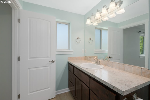 5615 Macleay Rd, Salem, OR 97317 - bathroom featuring vanity, wood finished floors, and baseboards