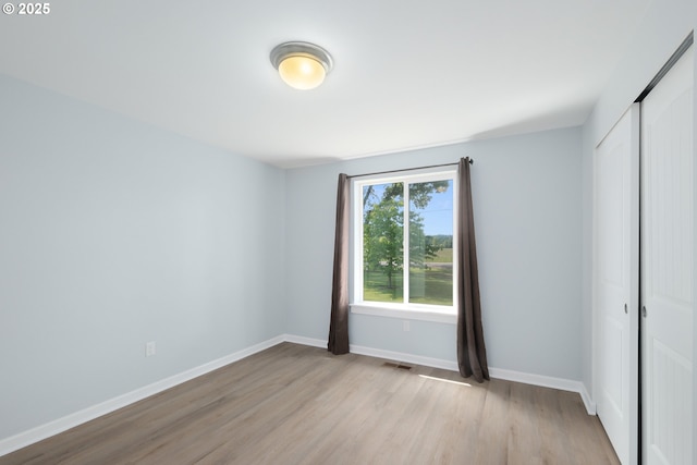 5615 Macleay Rd, Salem, OR 97317 - unfurnished bedroom with a closet, light wood-style floors, and baseboards