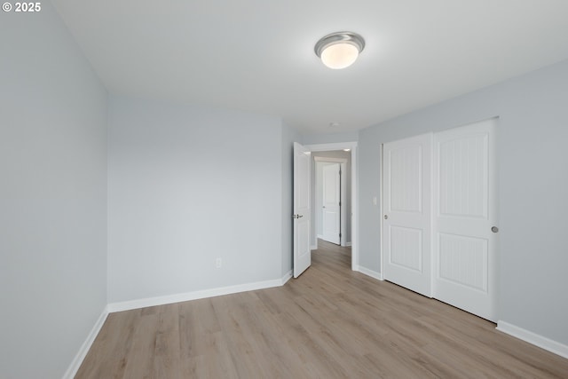 5615 Macleay Rd, Salem, OR 97317 - unfurnished bedroom featuring light wood-style floors, baseboards, and a closet