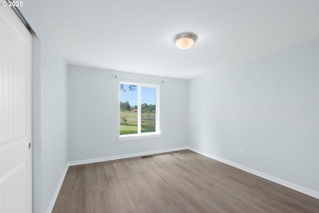 5615 Macleay Rd, Salem, OR 97317 - spare room featuring wood finished floors and baseboards