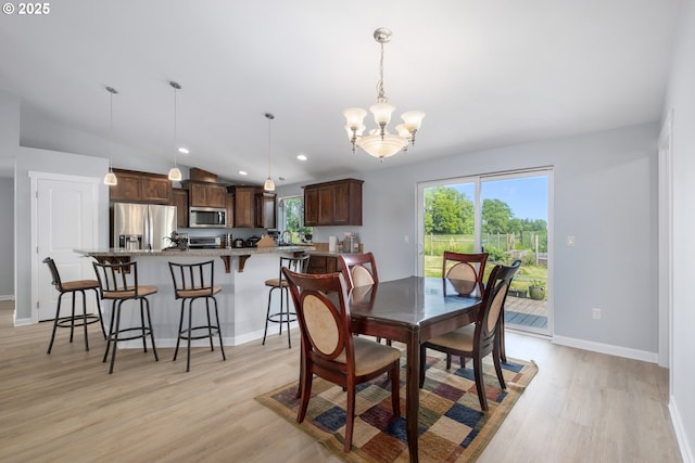 5615 Macleay Rd, Salem, OR 97317 - dining space with light wood-type flooring, a chandelier, baseboards, recessed lighting, and lofted ceiling