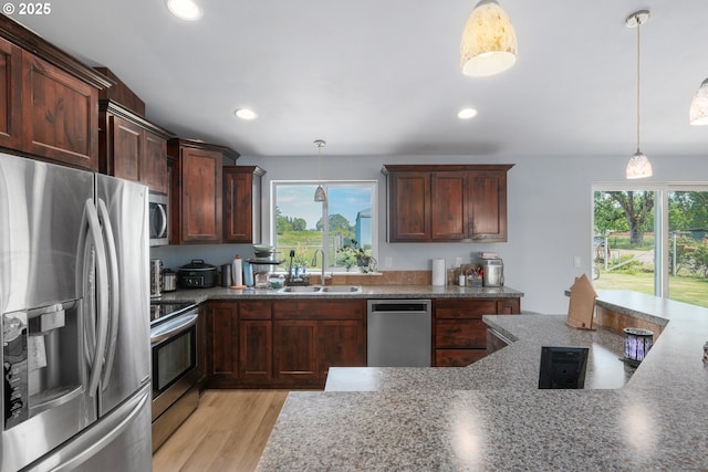 5615 Macleay Rd, Salem, OR 97317 - kitchen with appliances with stainless steel finishes, a sink, light wood-style flooring, stone counters, and recessed lighting