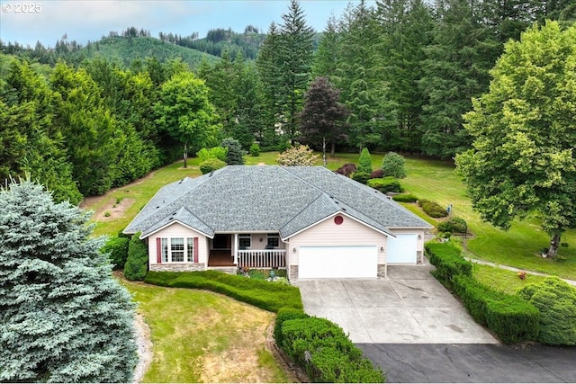 110 Dolph Dr, Ariel, WA 98603 - view of front of property with a garage, covered porch, stone siding, driveway, and a front yard