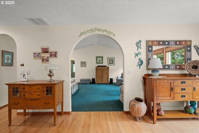 110 Dolph Dr, Ariel, WA 98603 - hall with arched walkways, wood finished floors, and a textured ceiling