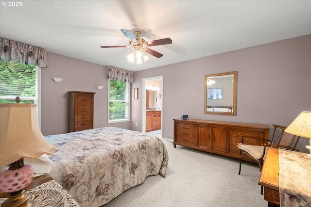 110 Dolph Dr, Ariel, WA 98603 - bedroom with multiple windows, light carpet, connected bathroom, and a ceiling fan
