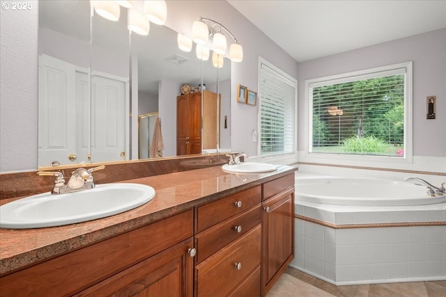 110 Dolph Dr, Ariel, WA 98603 - bathroom with double vanity, a garden tub, a shower stall, and tile patterned floors