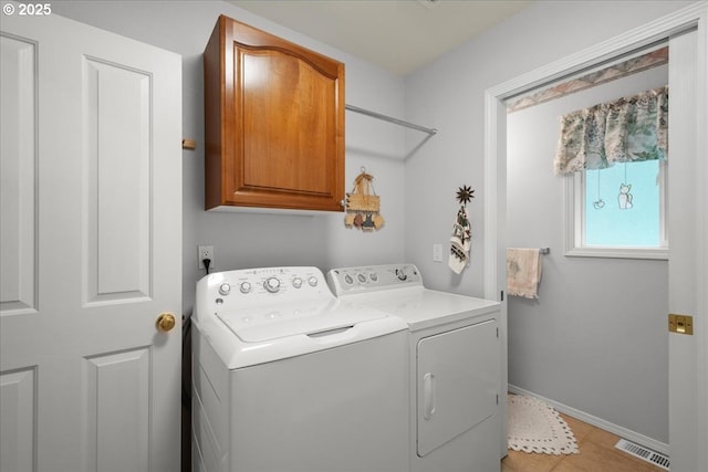 110 Dolph Dr, Ariel, WA 98603 - laundry area featuring cabinet space, independent washer and dryer, and light tile patterned floors