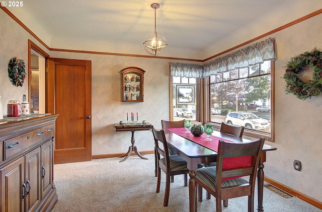 carpeted dining area with an inviting chandelier