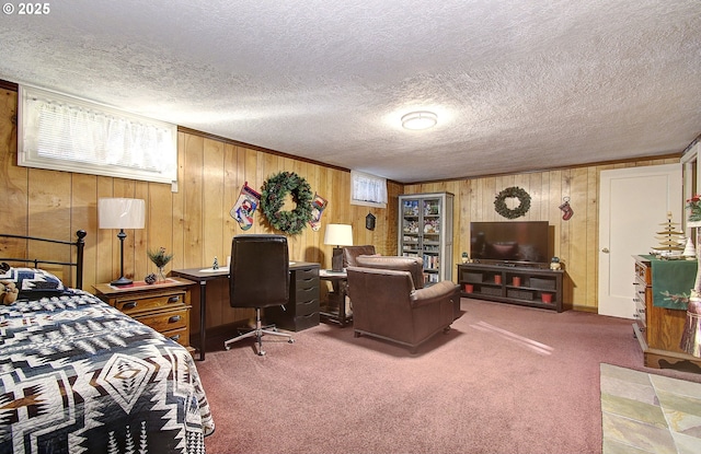 carpeted bedroom with wood walls and a textured ceiling